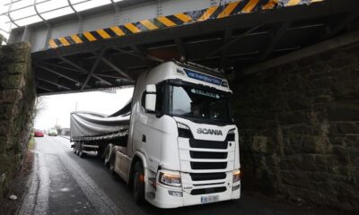 In pictures: Lorry gets wedged after crashing into railway bridge