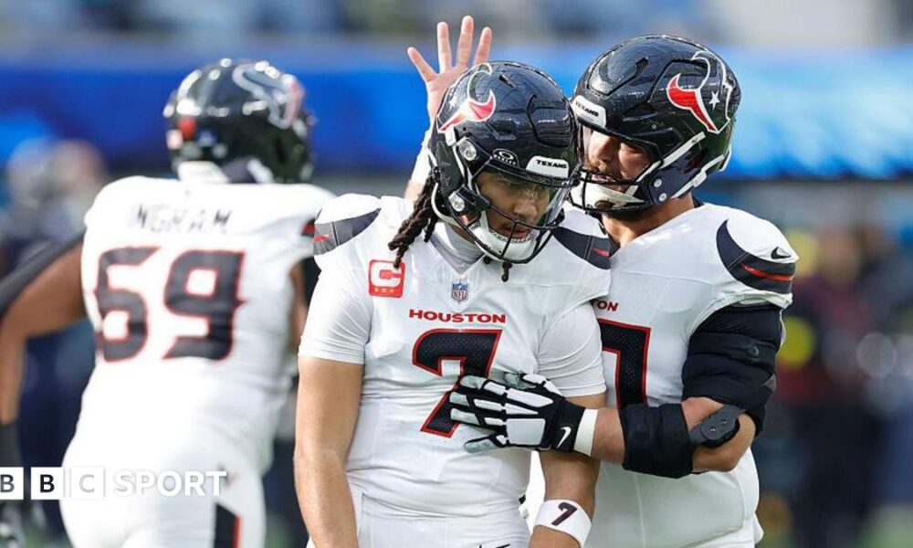 CJ Stroud celebrates a touchdown pass with Jake Andrews of the Houston Texans during the first quarter against the Los Angeles Chargers