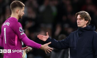 Thomas Frank, Manager of Tottenham Hotspur, shakes hands with Guglielmo Vicario