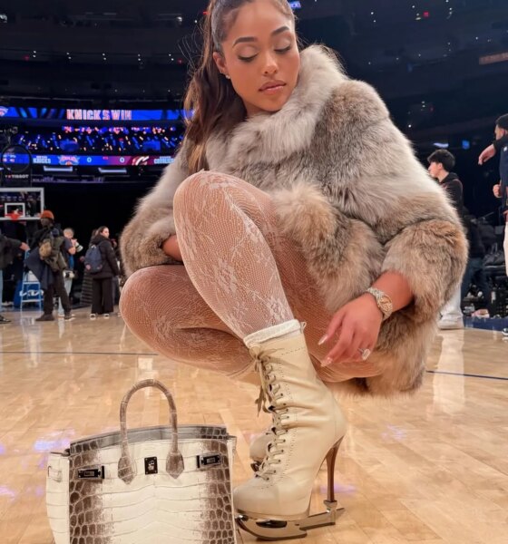 Jordyn Woods Courtside in Fur with an Hermes Himalayan Birkin and Dsquared2 Stiletto Boots