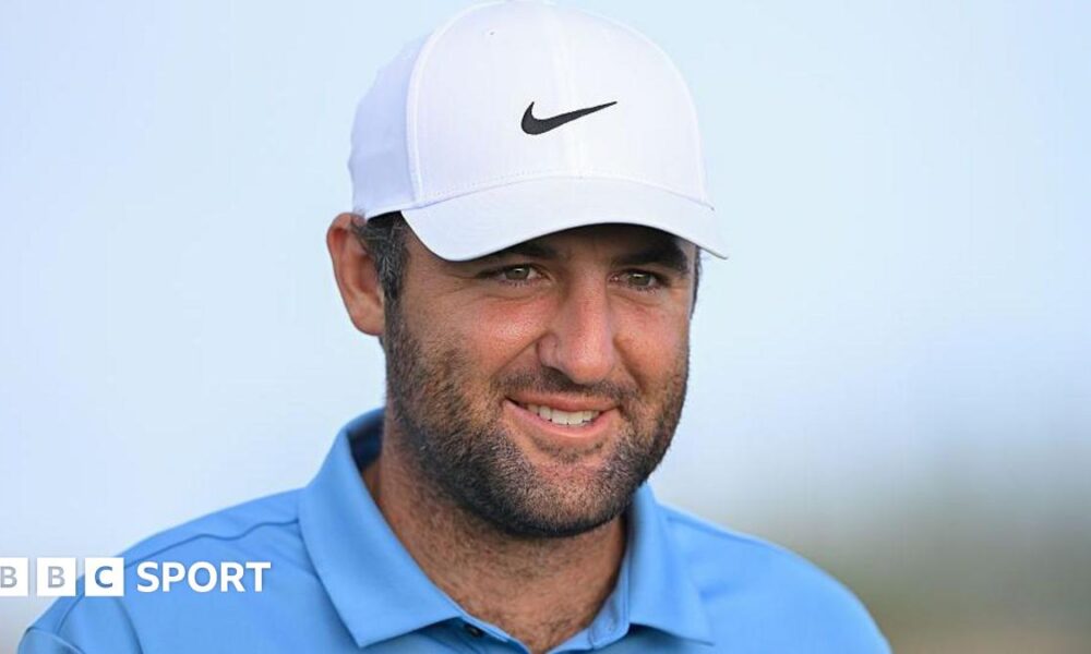 Scottie Scheffler smiles during a round