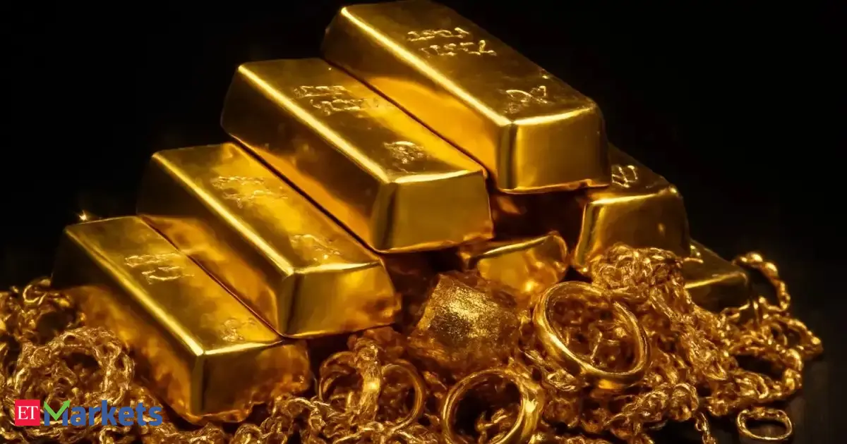 Gold edges lower from near three-week peak on profit-taking