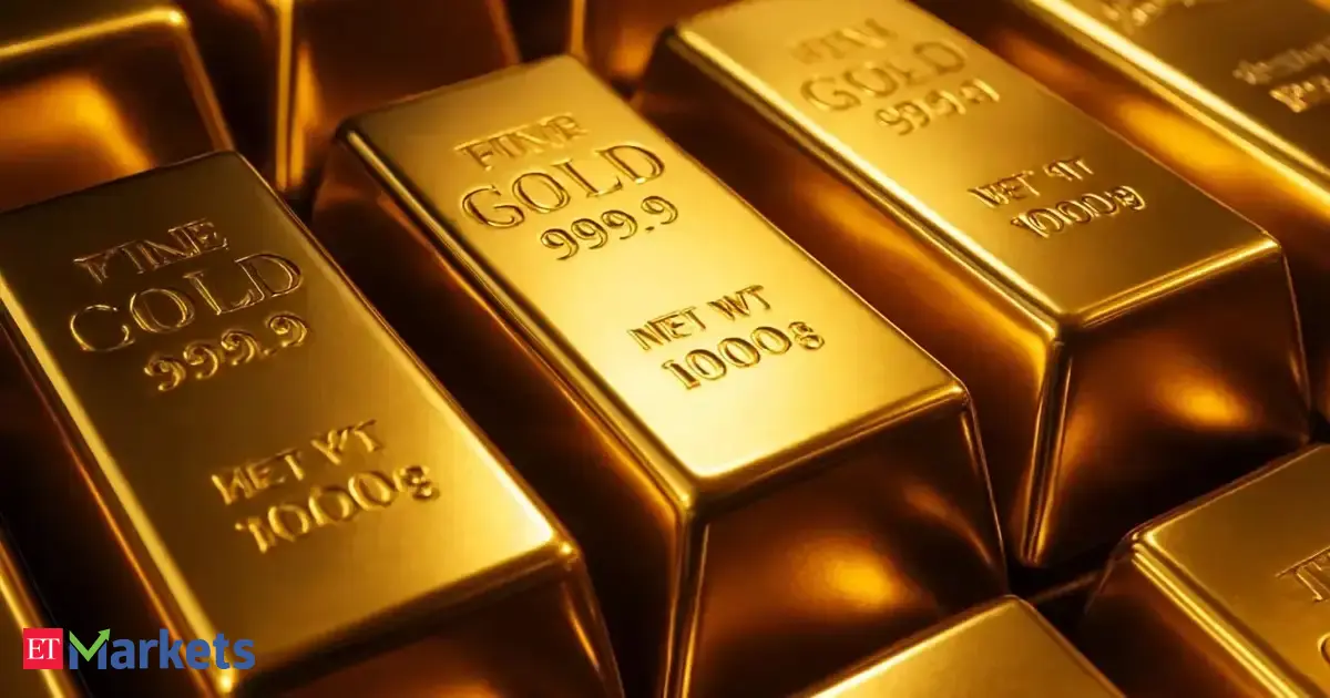 Gold edges lower as investors book profits