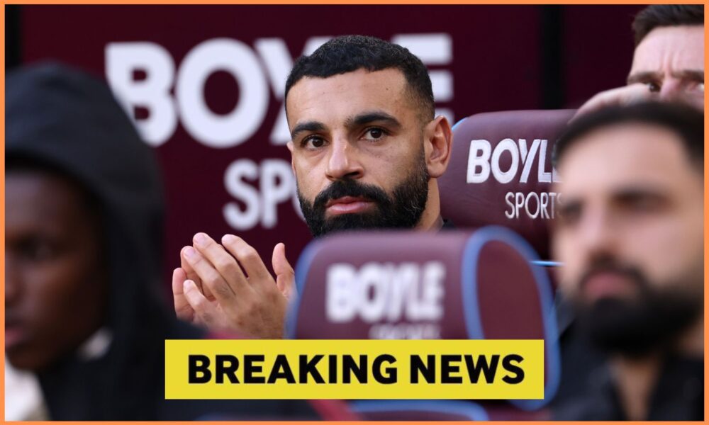 Mohamed Salah looks on from the Liverpool bench