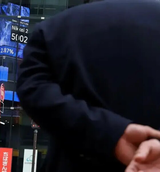 Japan's Topix gauge touches record high on easing debt concerns