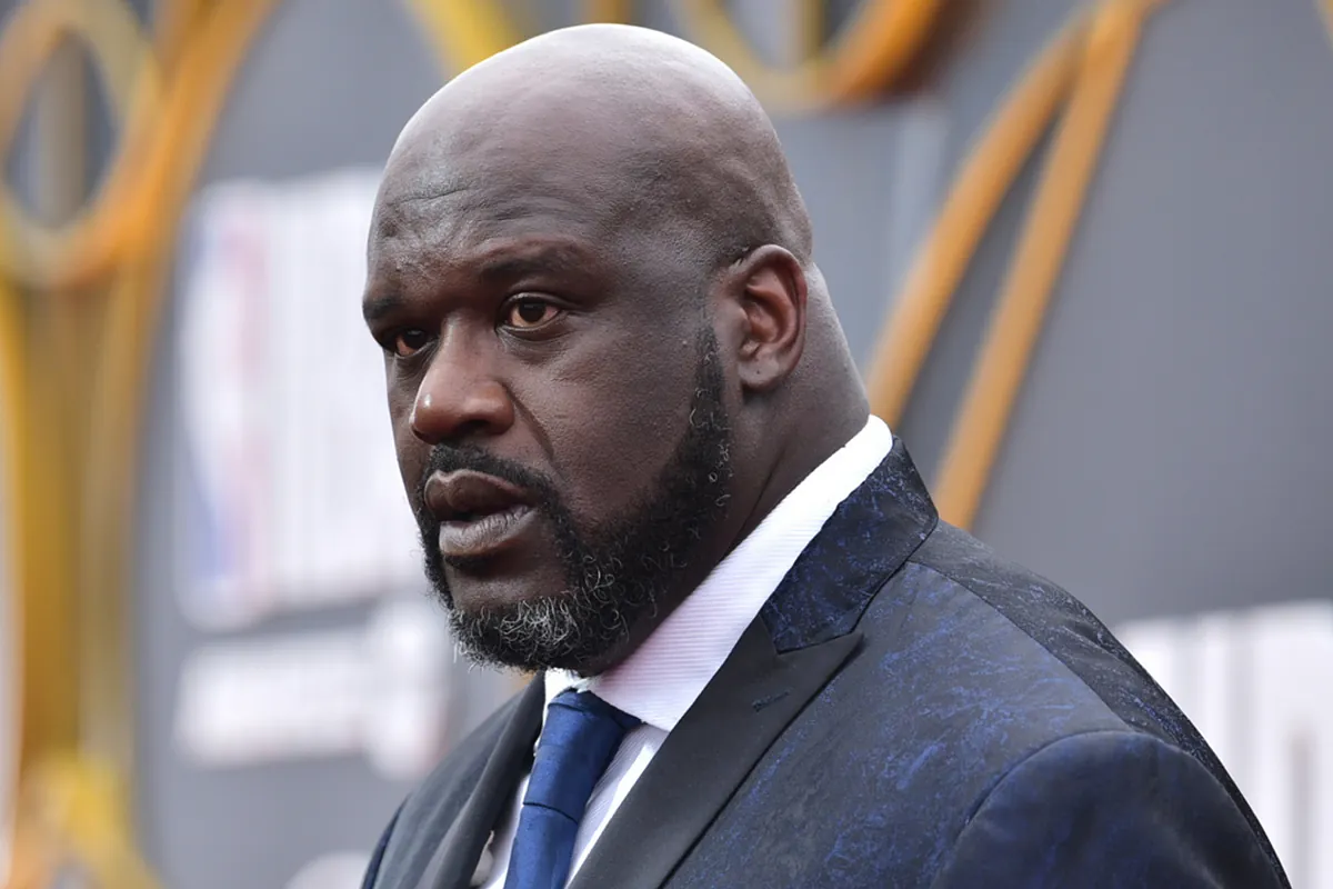A giant helping another achieve his dream: Shaquille O'Neal helps a young man become a police officer