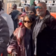 Karrueche Tran and Deion Sanders Support Shedeur Sanders, with Karrueche in a Brown Puffy Leather Rowen Rose Coat