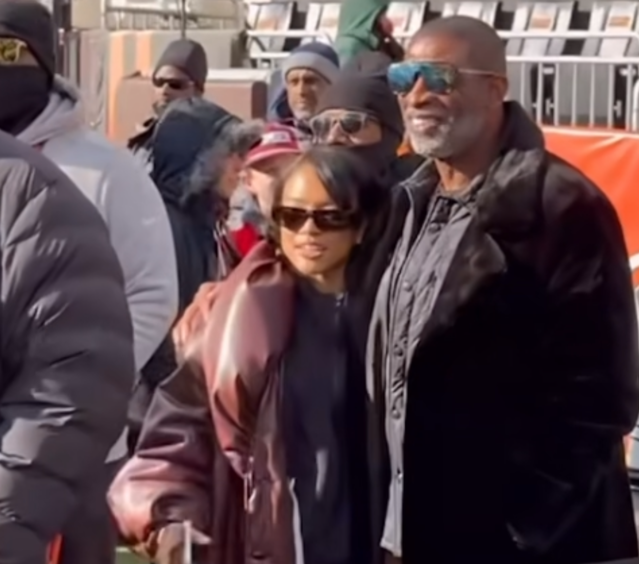 Karrueche Tran and Deion Sanders Support Shedeur Sanders, with Karrueche in a Brown Puffy Leather Rowen Rose Coat