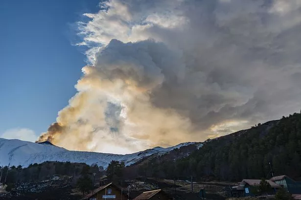 Moment snow-covered Mount Etna erupts spewing lava and ash