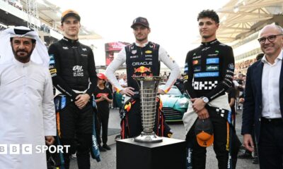 FIA president Mohammed Ben Sulayem, McLaren's Oscar Piastri, Red Bull's Max Verstappen, McLaren's Lando Norris and F1 president Stefano Domenicali pose with the FIA F1 drivers' championship trophy before the Abu Dhabi Grand Prix