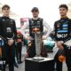 FIA president Mohammed Ben Sulayem, McLaren's Oscar Piastri, Red Bull's Max Verstappen, McLaren's Lando Norris and F1 president Stefano Domenicali pose with the FIA F1 drivers' championship trophy before the Abu Dhabi Grand Prix