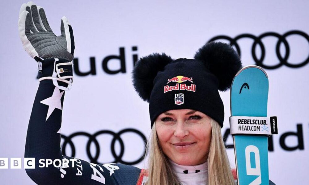 Third-placed Lindsey Vonn celebrates on the podium
