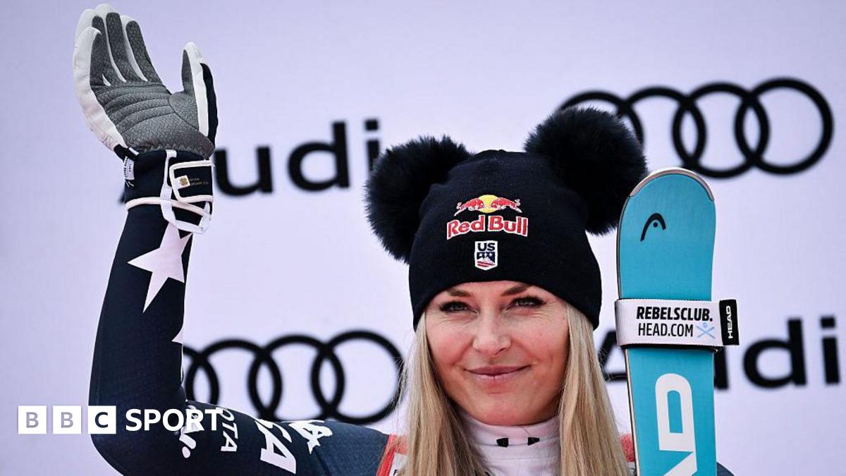 Third-placed Lindsey Vonn celebrates on the podium