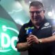 Gary Anderson celebrates beating Jermaine Wattimena in the PDC World Championship