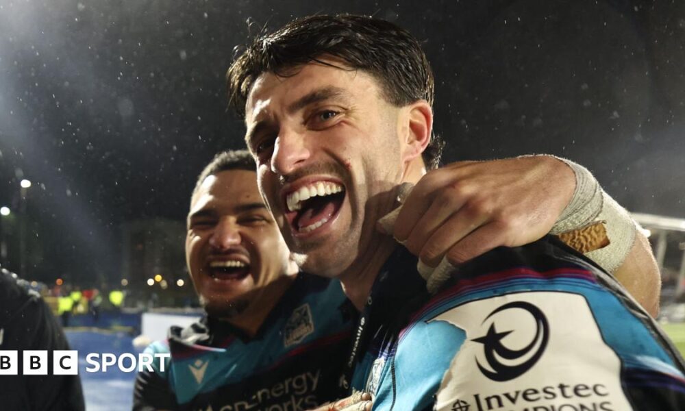Sione Tuipulotu and Adam Hastings celebrate after Glasgow's win over Toulouse