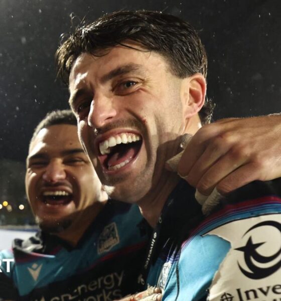 Sione Tuipulotu and Adam Hastings celebrate after Glasgow's win over Toulouse