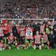 Sunderland players and coaching staff pose for a picture at the end of their win over Newcastle