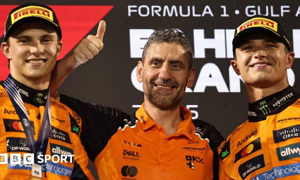 Lando Norris and Oscar Piastri clench their fists in celebration after finishing one-two, with Piastri winning, in this year's Spanish Grand Prix