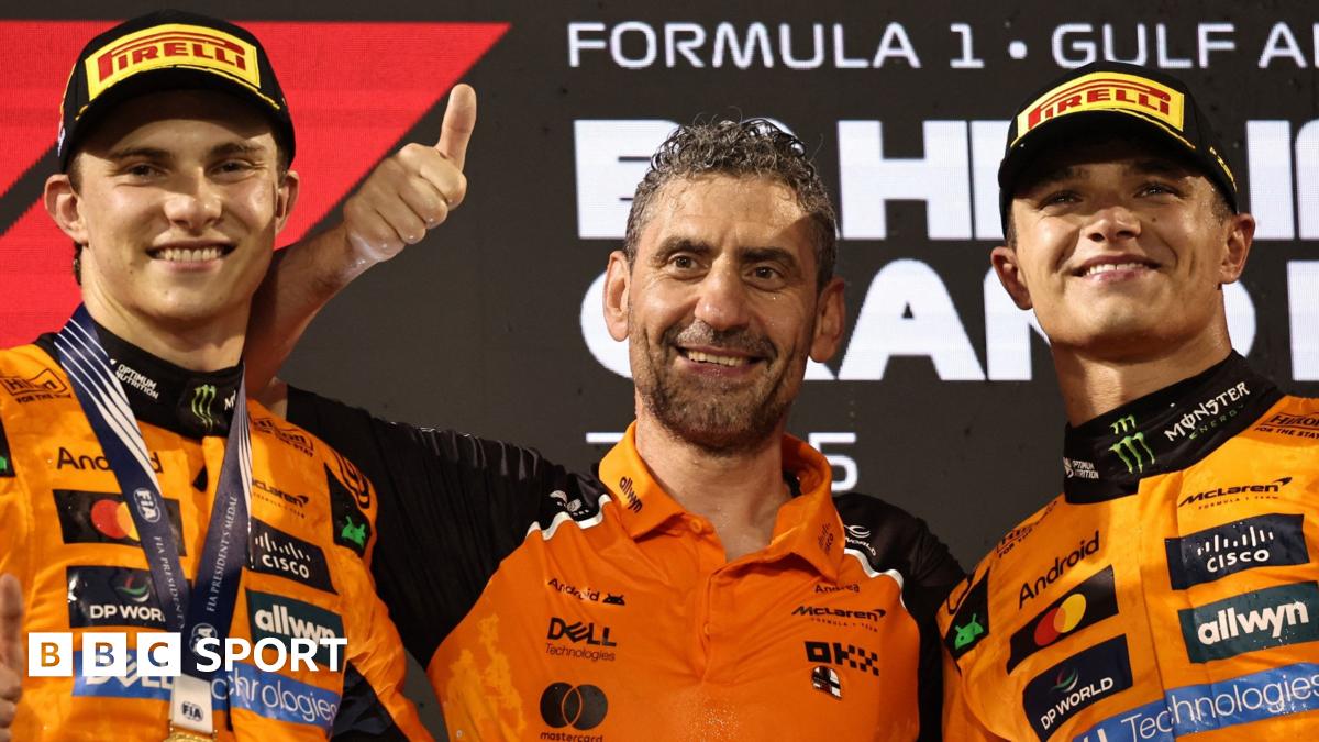Lando Norris and Oscar Piastri clench their fists in celebration after finishing one-two, with Piastri winning, in this year's Spanish Grand Prix