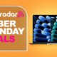 A pair of MacBook Air laptops against an orange TechRadar Cyber Monday deals background