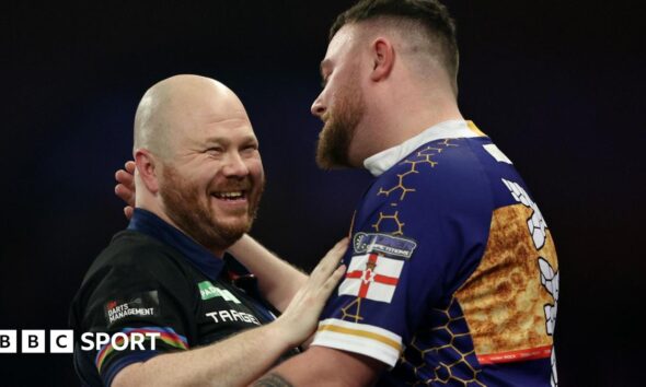 Justin Hood shakes hands with Josh Rock