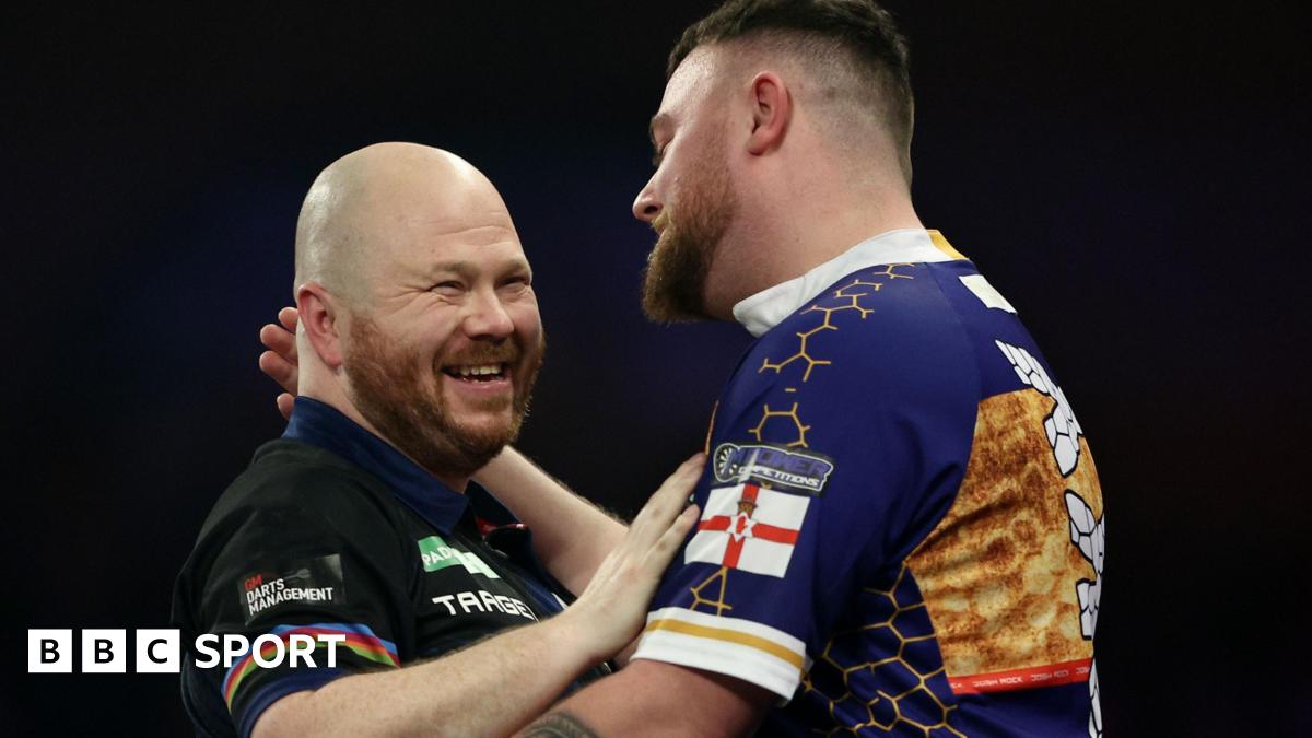 Justin Hood shakes hands with Josh Rock