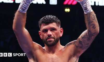 Joe Cordina raises arms aloft in triumph