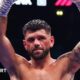 Joe Cordina raises arms aloft in triumph