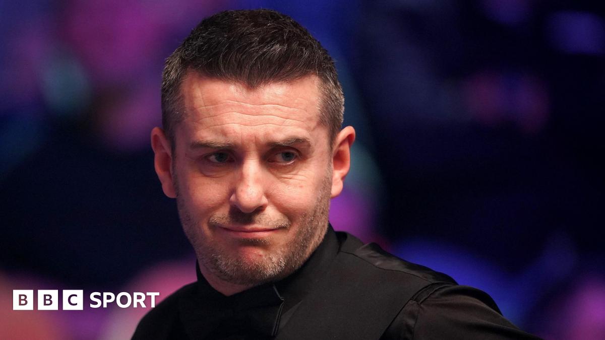 Mark Selby looks at the table