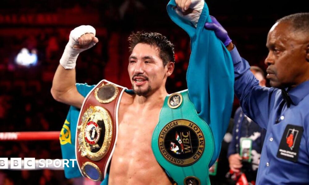 Janibek Alimkhanuly celebrates after beating Hassan N'Dam N'Jikam in 2021