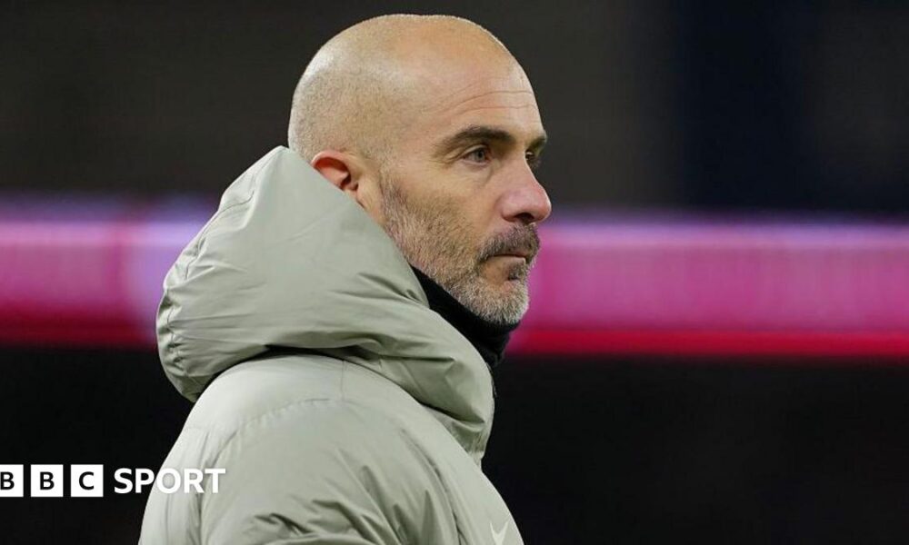 Chelsea manager Enzo Maresca looking across the pitch at Cardiff City