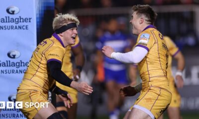 Henry Pollock (left) looks at Tommy Freeman (right) as both hold their arms out and mouths open ready to embrace in celebration of a try