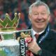 Sir Alex Ferguson holding the Premier League trophy