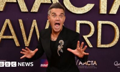 Take That singer Robbie Williams surprises 94-year-old fan