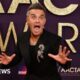 Take That singer Robbie Williams surprises 94-year-old fan