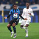 BERGAMO, ITALY - DECEMBER 09: Ademola Lookman of Atalanta controls the ball whilst under pressure from Moises Caicedo of Chelsea during the UEFA Champions League 2025/26 League Phase MD6 match between Atalanta BC and Chelsea FC at Stadio di Bergamo on December 09, 2025 in Bergamo, Italy. (Photo by Carl Recine/Getty Images)