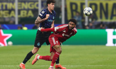 MILAN, ITALY - DECEMBER 09: Joe Gomez of Liverpool FC competes for the ball with Alessandro Bastoni of FC Internazionale during the UEFA Champions League 2025/26 League Phase MD6 match between FC Internazionale Milano and Liverpool FC at Stadio San Siro on December 09, 2025 in Milan, Italy. (Photo by Marco Luzzani/Getty Images)