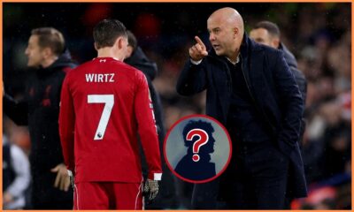 Florian Wirtz and Arne Slot talk on the touchline during Leeds vs Liverpool