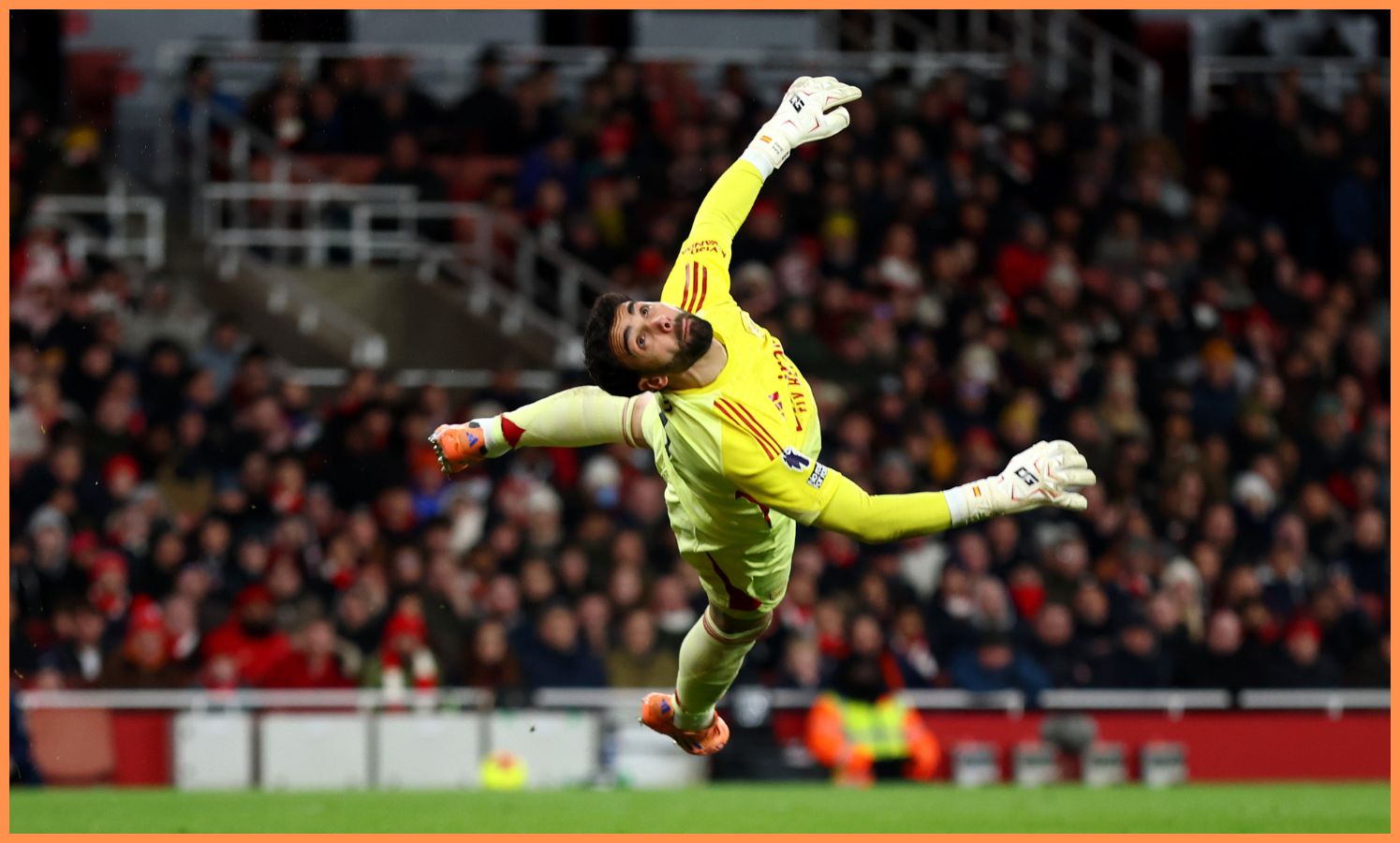 Arsenal goalkeeper David Raya makes a save from Brighton