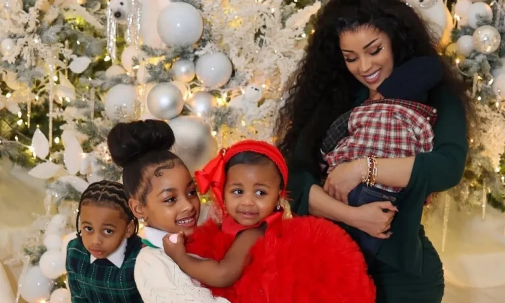 Cardi B Celebrates Christmas with Her Children in an Olive Green Bodycon Dress with Silver Metallic Heels