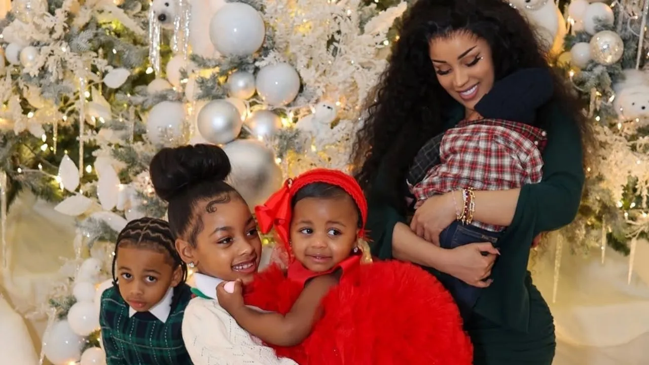 Cardi B Celebrates Christmas with Her Children in an Olive Green Bodycon Dress with Silver Metallic Heels