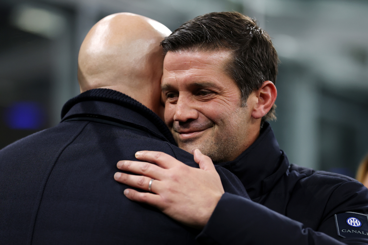 MILAN, ITALY - DECEMBER 09: Arne Slot, Manager of Liverpool, and Cristian Chivu, Head Coach of FC Internazionale Milano, embrace prior to the UEFA Champions League 2025/26 League Phase MD6 match between FC Internazionale Milano and Liverpool FC at Stadio San Siro on December 09, 2025 in Milan, Italy. (Photo by Justin Setterfield/Getty Images)