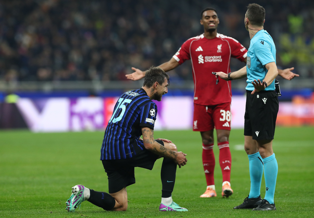 MILAN, ITALY - DECEMBER 09: Francesco Acerbi of FC Internazionale lies injured during the UEFA Champions League 2025/26 League Phase MD6 match between FC Internazionale Milano and Liverpool FC at Stadio San Siro on December 09, 2025 in Milan, Italy. (Photo by Marco Luzzani/Getty Images)