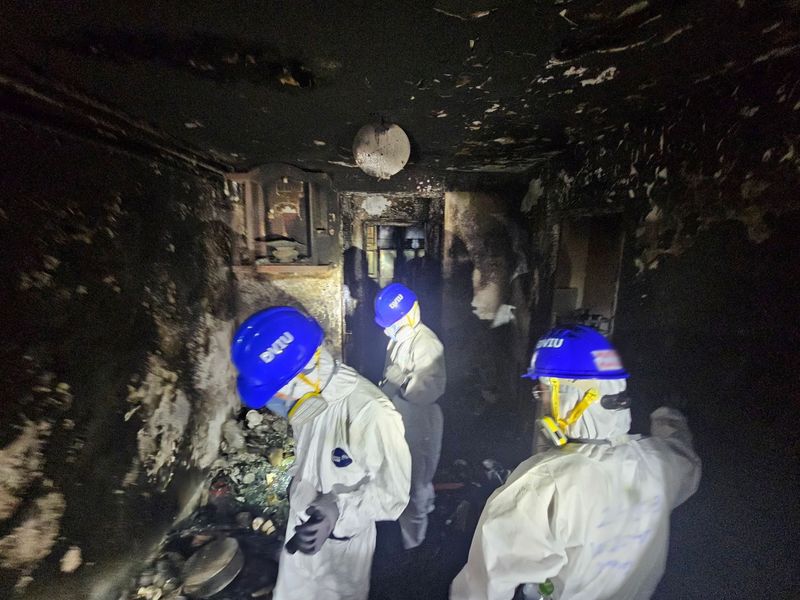 Police comb fire-ravaged Hong Kong apartments, death toll at 146