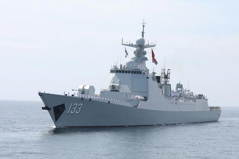 Exclusive-China massing military ships across region in show of maritime force, sources say