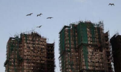 Hong Kong fire: Echoes of loss below burnt towers