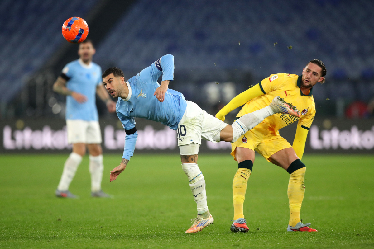 ROME, ITALY - DECEMBER 04: Mattia Zaccagni of Lazio is challenged by Adrien Rabiot of AC Milan during the Coppa Italia Round of 16 match between SS Lazio and AC Milan at Olimpico Stadium on December 04, 2025 in Rome, Italy. (Photo by Paolo Bruno/Getty Images)