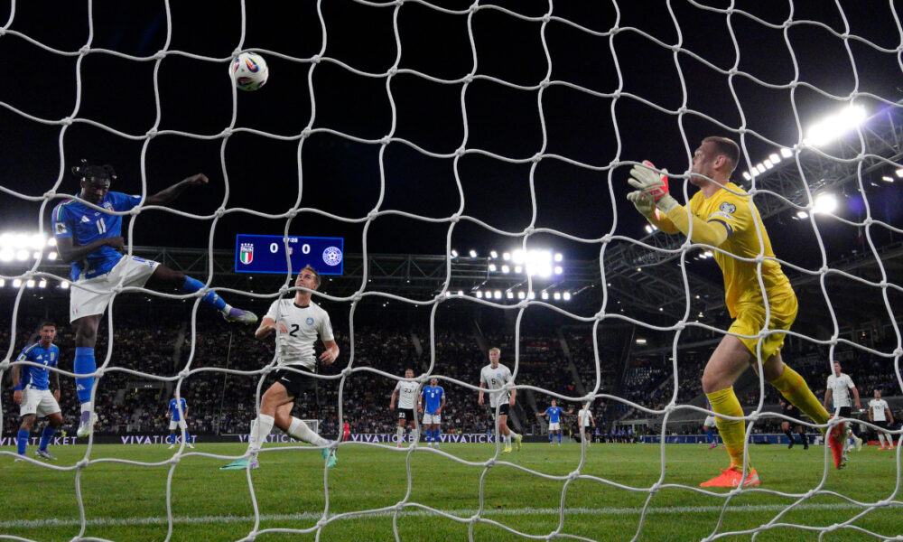 BERGAMO, ITALY - SEPTEMBER 05: (EDITORS NOTE: In this photo taken from a remote camera from behind the goal) Moise Kean of Italy scores his team