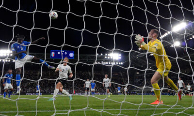 BERGAMO, ITALY - SEPTEMBER 05: (EDITORS NOTE: In this photo taken from a remote camera from behind the goal) Moise Kean of Italy scores his team