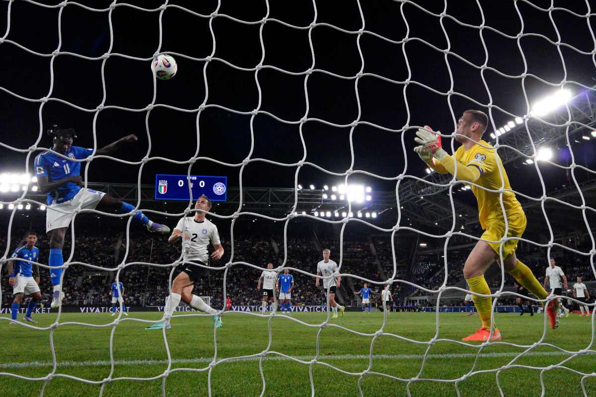 BERGAMO, ITALY - SEPTEMBER 05: (EDITORS NOTE: In this photo taken from a remote camera from behind the goal) Moise Kean of Italy scores his team